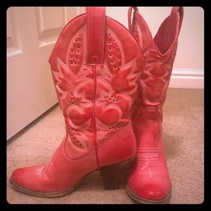 Very volatile red cowgirl boots.